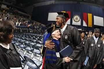 Student hugs faculty at graduation