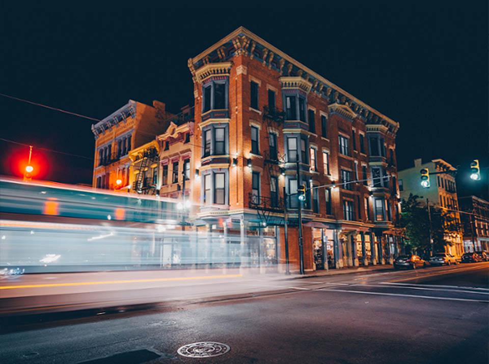 Long exposure photograph of a car driving in Cincinnati at night